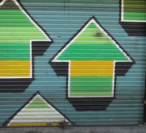 Graffiti showing upward pointing arrows