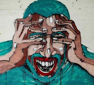 Graffiti image of man putting hands over face