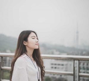 Woman with eyes closed looking calm